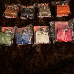 Hermes mini Kelly bag charm with Hermes Twilly perfume.